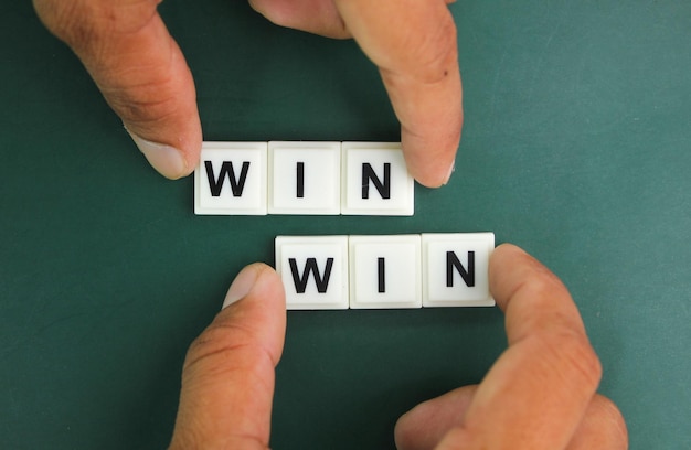 Photo hands holding letters of the alphabet with the word win win compromise perfect consent