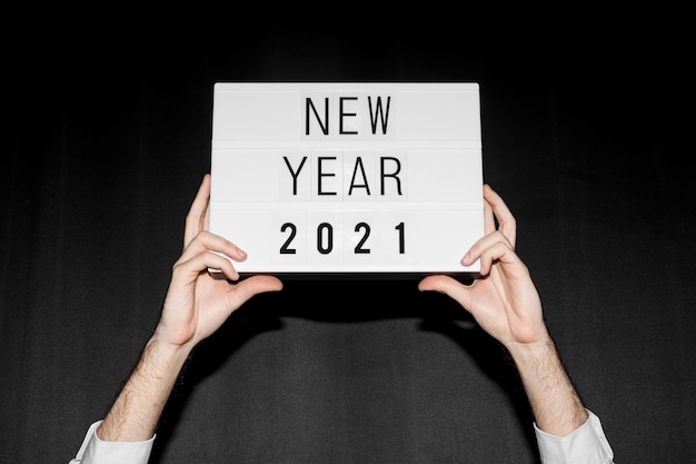 Hands holding new year 2021 sign