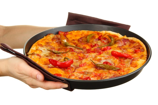 Photo hands holding pepperoni pizza in pan isolated on white