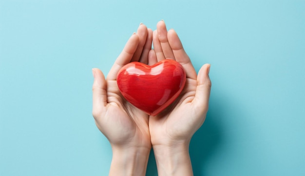 Hands holding a red heart symbolizing health care love organ donation day