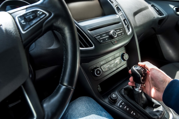 Hands inside the car, preparing for the trip. auto interior