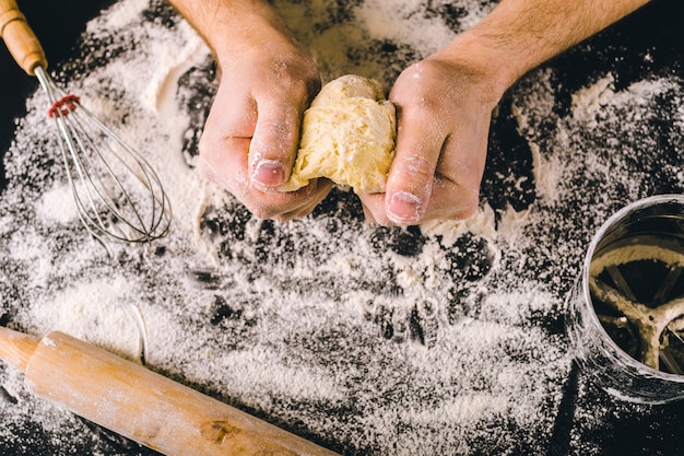 Hands kneading a dough