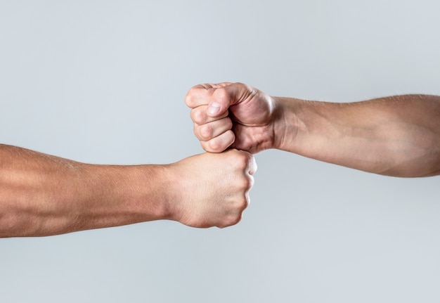 Photo hands of man people fist bump team teamwork, success. man giving fist bump.