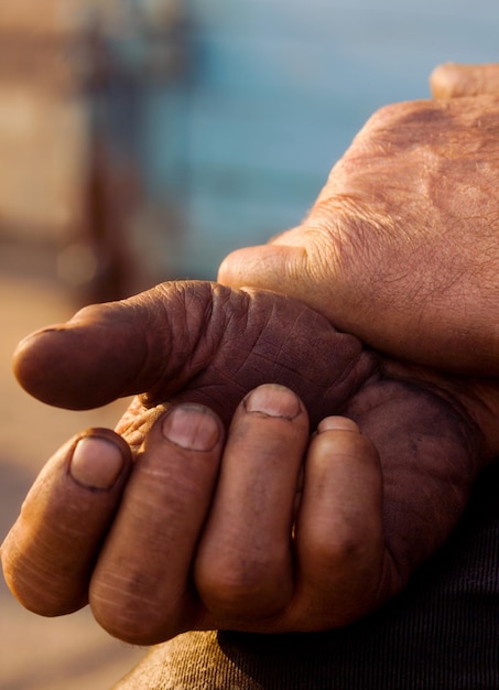 The hands of men resting after a grueling work A symbol of labor and fatigue