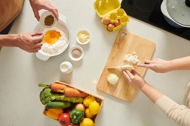 Hands of People Making Pie