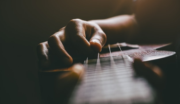 Hands playing acoustic ukulele guitar.Music skills show