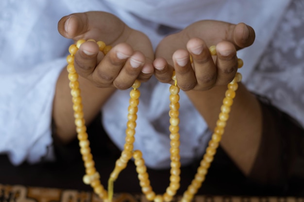 Hands of praying Muslim Women with tasbihHand of muslim Women praying with praying beads