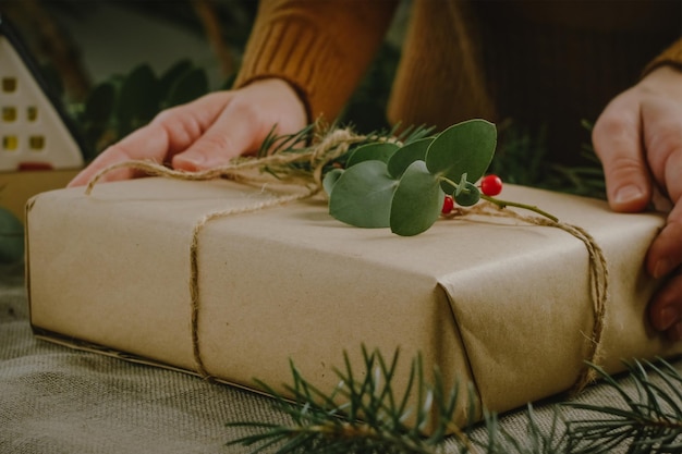 Hands preparing Christmas present