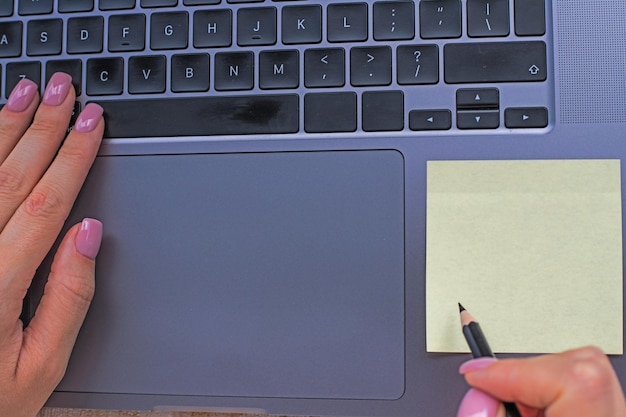 Hands Pressing Computer Keyboard Keys While Writing With Pencil In Notepad Palms Typing Notebook Keypad And Writing Pencil Over Paper