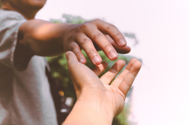 hands reaching out to help each other.