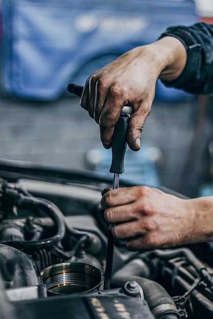 Hands of repairmen toiling in locksmiths workshop