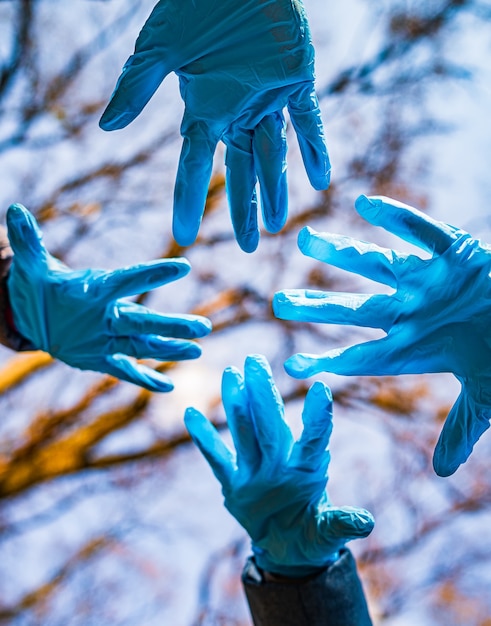 Hands in rubber medical gloves