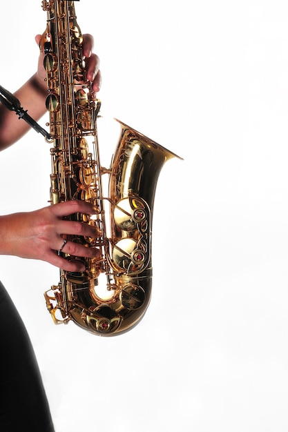 Hands of a saxophonist on a white background