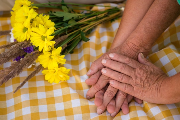 Hands of senior couple