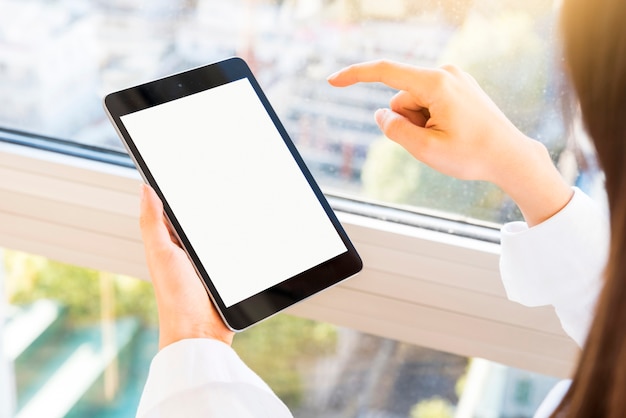 Hands showing a tablet with blank screen