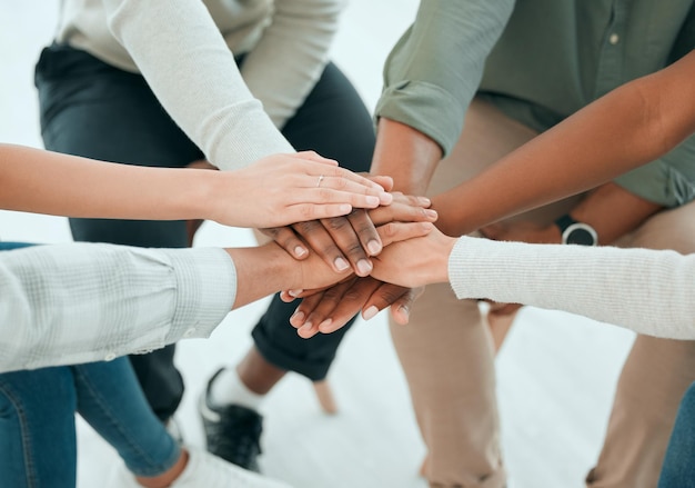 Hands stack group and team with support care and together with solidarity advice and empathy at job People friends and helping hand for teamwork commitment and community with trust in top view