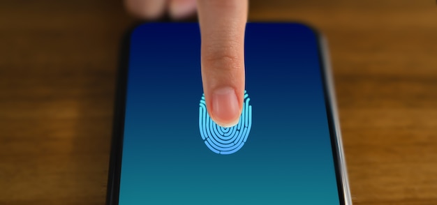 Hands touching smartphone and show the fingerprint scanner screen to access online.