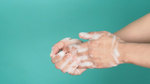 Hands washing gesture with foaming hand soap