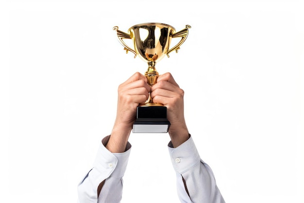 Hands of a winner holding a gold trophy cup high symbolizing success victory