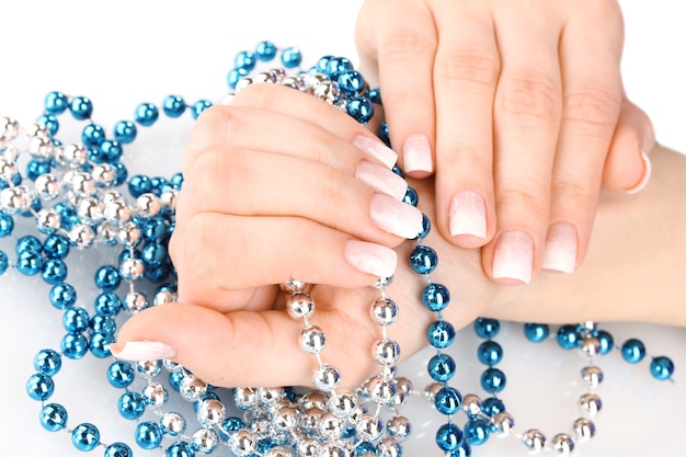 Hands with beautiful winter design and beads isolated on white