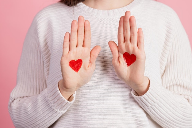 Hands with drawn hearts valentine's day concept