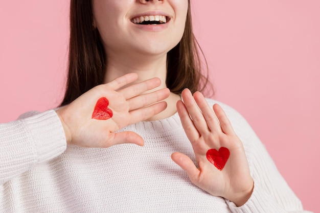 Hands with drawn hearts valentine's day concept