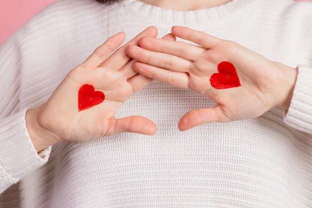 Hands with drawn hearts valentine's day concept