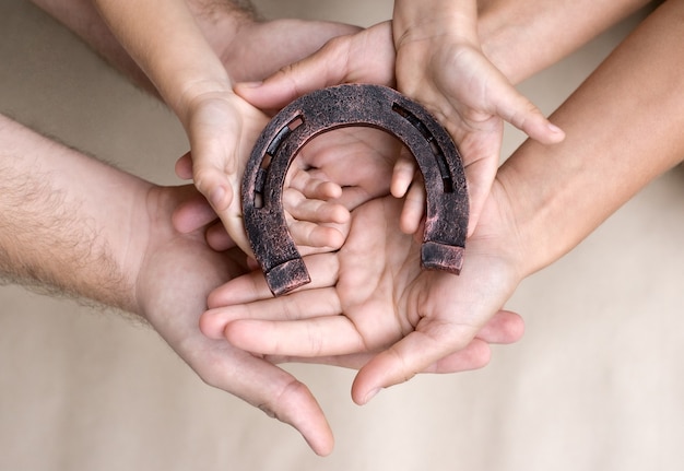 Hands with horseshoe for good luck