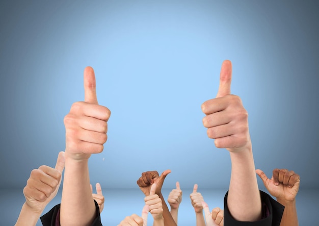 Hands with thumbs up likes in front of blue background