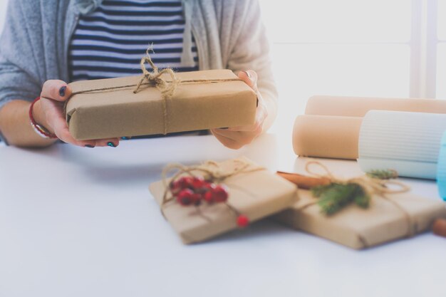 Hands of woman holding christmas gift box