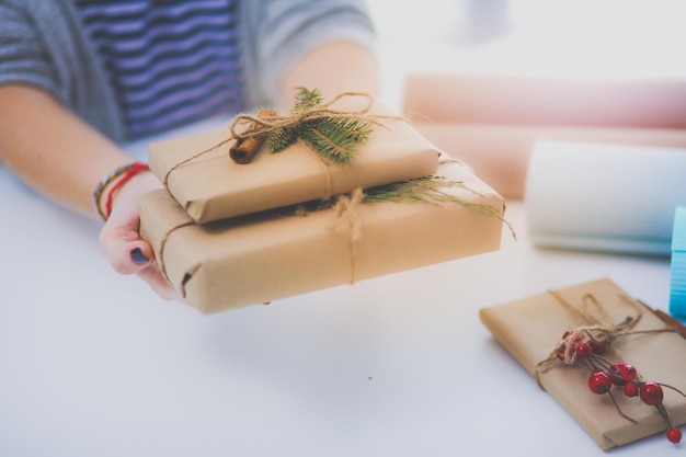 Hands of woman holding christmas gift box