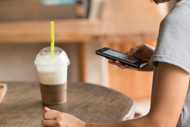 Hands of a woman using a mobile cell phone