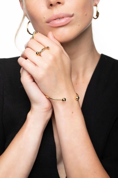 Hands of a young girl with rings