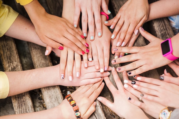 Hands of young people in the nature team concept