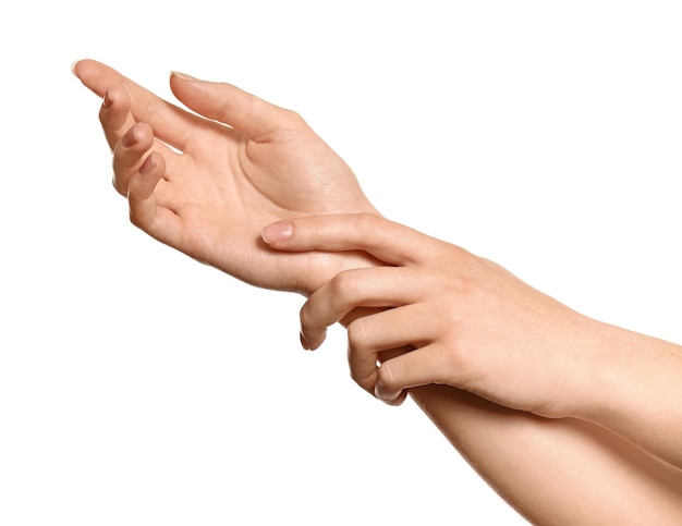 Hands of young woman with healthy skin softened by cream with moisturizing effect on white background