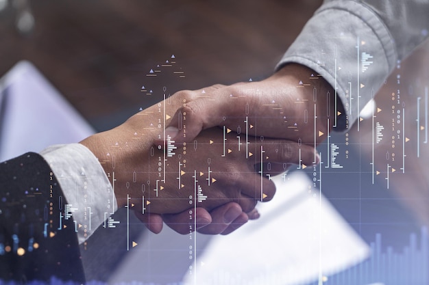 A handshake as a symbol of successful transaction on brokerage services at international investment bank Capital market stock trading Financial hologram chart Women in business