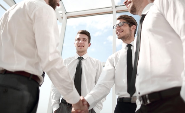 Handshake business partners in the officebusiness concept