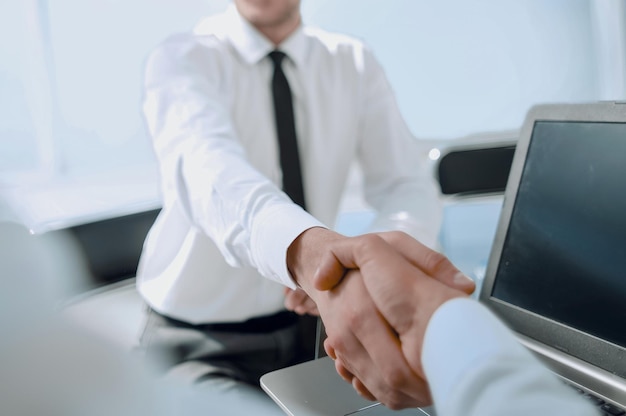 The handshake business partners for their desk