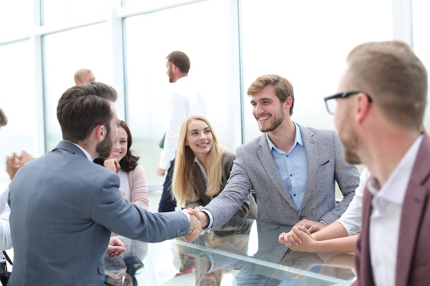 Handshake business people at an informal meeting