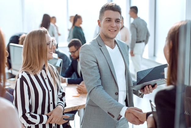 Handshake of business people in a modern office