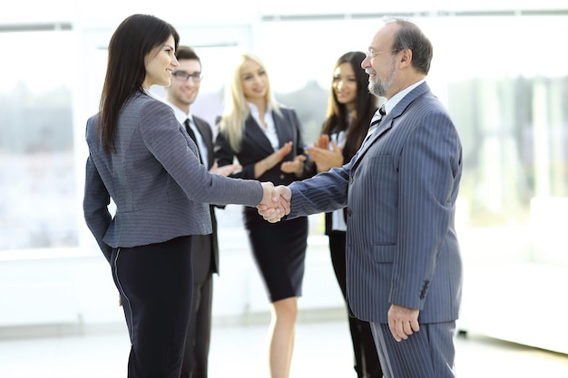 Handshake of a businessman and business woman