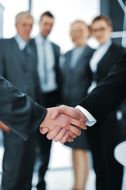 Handshake isolated on business background