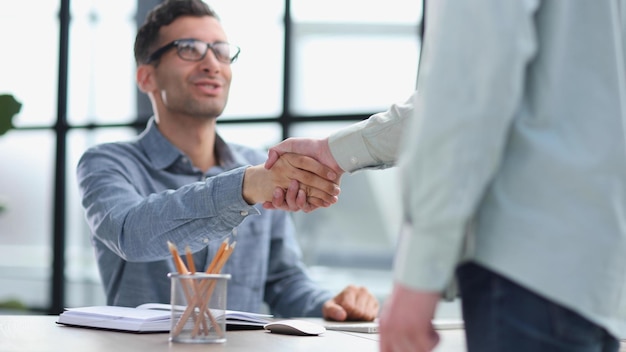 Handshake and meeting in teamwork for partnership or collaboration in boardroom