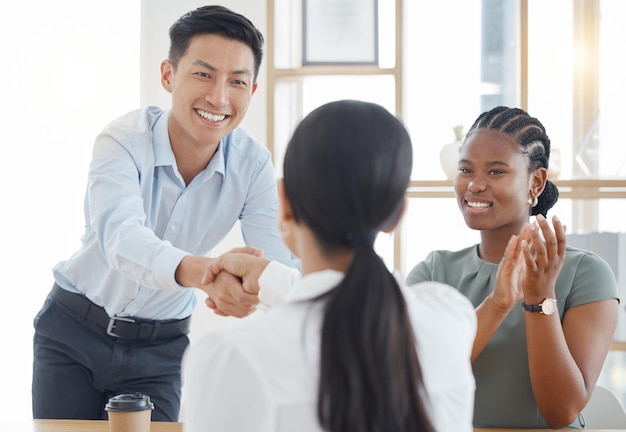 Handshake office and success with partnership deal together at corporate company meeting Professional b2b agreement and negotiation with cheerful clapping applause in office workplace