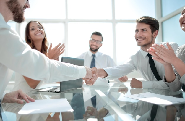 Handshake of reliable partners in the office