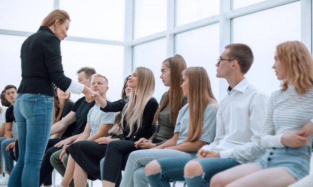 Handshake of young people during business training