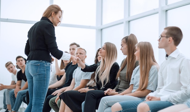 Photo handshake of young people during business training