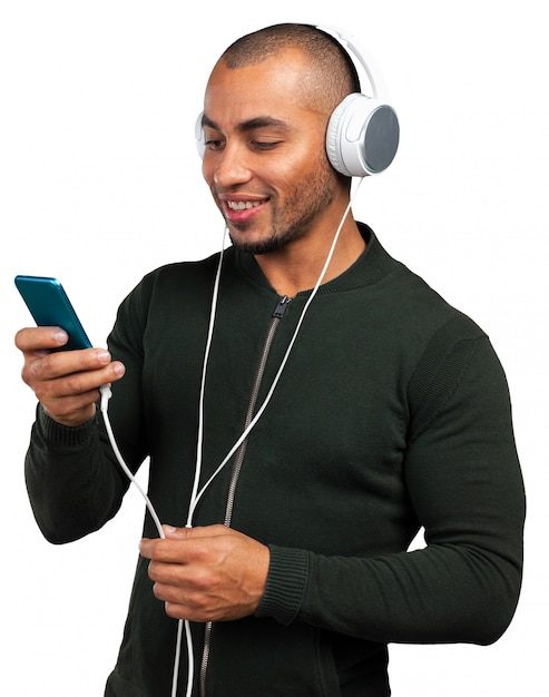 Handsome Afro American man is listening to music