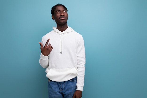 Handsome american man casual wear with idea on blue background