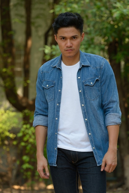 Handsome Asian man at the park outdoors